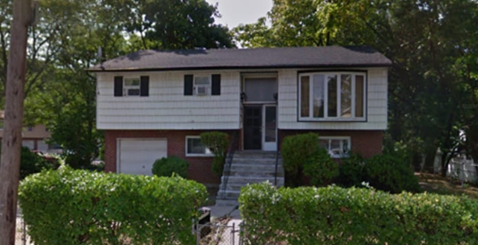 E-192 House with Green Bushes in front